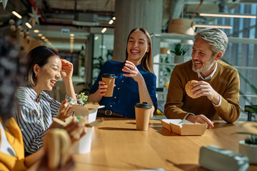 Diverse business people enjoying lunch break together