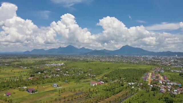 Drone Aerial View Tropical Village Coconut Tree and Mountain Landscape
