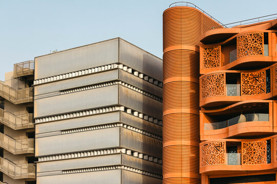 The Masdar Institute of Science and Technology exterior with green garden on the foreground. Sustainable environment.