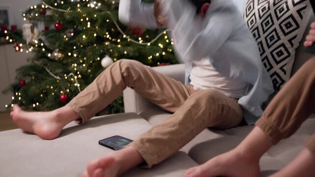 The boy begins to fly into a rage and smash his phone while playing a game on it