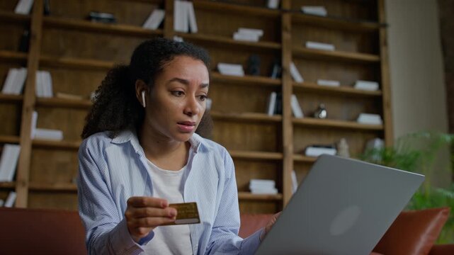 Worried woman checking credit card details online