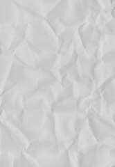 Fototapeta premium Textured Paper with Shadows: A close-up shot revealing a sheet of textured paper, its surface marked by intricate folds and creases, casting subtle shadows that highlight the uneven texture.