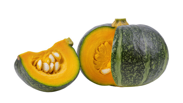 Green striped Kabocha pumpkin halved showing orange flesh and seeds