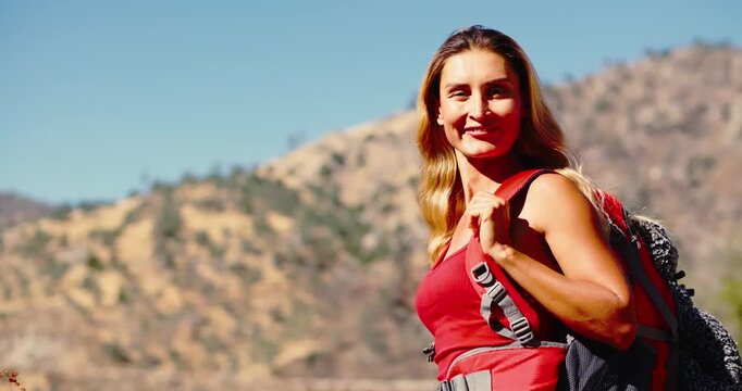 Woman Hiking in Mountain Landscape with Backpack