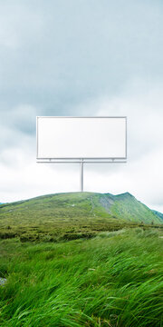 Minimal billboard mockup on green hill with soft sky and large copy space. Concept of clean advertising, brand focus, marketing template and visual communication.