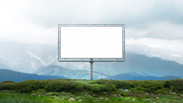 Framed billboard mockup on mountain background with centered copy space. Concept of advertising template, brand presentation, marketing campaign and outdoor media placement.