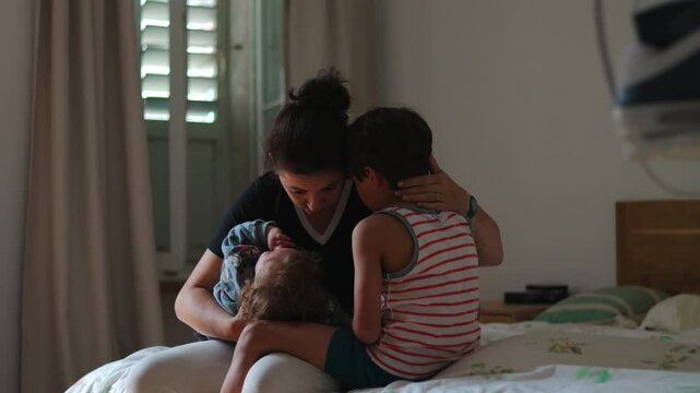 Mother gently caresses child then pulls him into warm embrace expressing empathy understanding and emotional reassurance creating intimate moment of love and connection at home