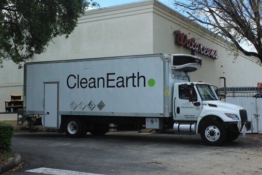 Clean Earth Specialty Waste Solutions box truck at a Walgreens drug store.