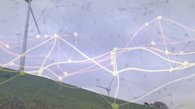 Large wind turbine rotating while camera panning and zooming, animated network showing energy flow