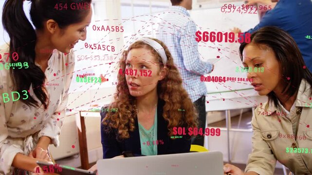 Three women collaborating around laptop, left woman showing tablet sparking crypto overlay analysis