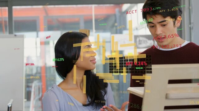 Two colleagues discussing monitor woman gesturing sparking AR finance graphics shifting for review