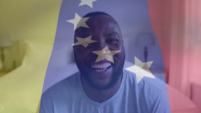 Man sitting in bedroom, tri band appearing, stars moving over face, smiling then laughing for media