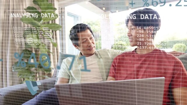 Father and son watching laptop, pie-chart appearing, expanding, showing animated data for education