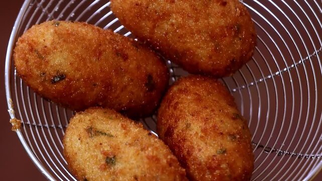 Chilli Garlic Cutlet Rolls packed with potato filling and fried to crisp texture bring a spicy veg snack to life. Cutlet, snack and appetizer visuals focus on crunchy coating and rich flavor profile.