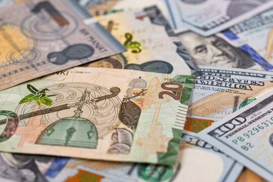 Macro shot of Azerbaijani Manat and US Dollar banknotes mixture