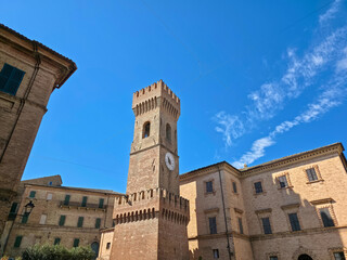 The historic Torre Civica clock tower and Piazza dei Martiri in Ostra, medieval village in Marche region, Italy © Buffy1982