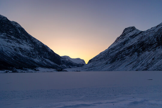 A beautiful winter sunrise scene near Geiranger. A colorful snowy landscape of Norway, UNESCO world heritage site.