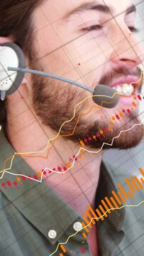 Vertical video: Mic host turning head and presenting while causing market charts tracking on face