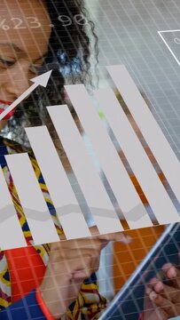 Vertical video: Woman tapping tablet in business causing pie charts over screen and collecting data