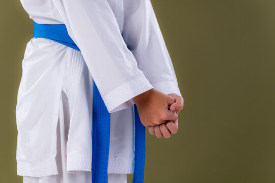 Shotokan ready stance, yoi, hands clenched and positioned correctly before technique execution.