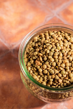 Close up of lentils on a tile surface 