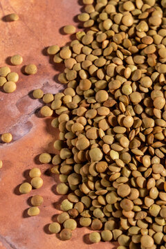 Close up of lentils on a tile surface 