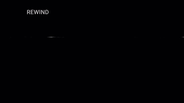 Retro VHS rewind screen with REWIND icon, static lines, and analog distortion on transparent background, overlay footage. 4K Video