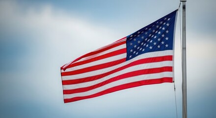 Obraz premium Celebrating flag day a majestic american flag waving proudly against a beautiful blue sky