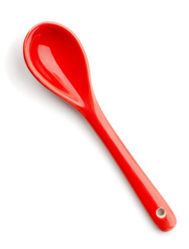 Top view of empty red ceramic spoon