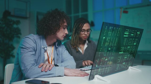 Team of IT engineers run complex program on advanced holographic display