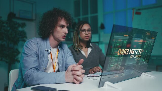 Programmers confront system failure on futuristic interface with visible bugs
