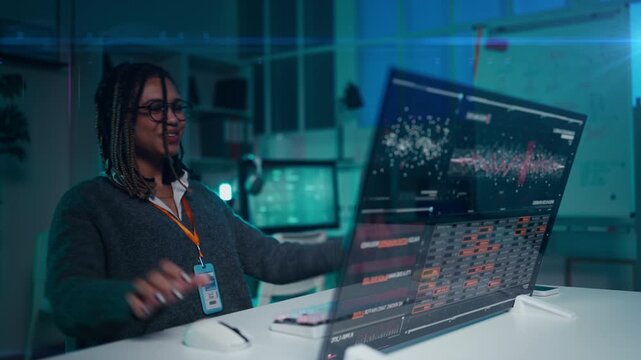 Happy female programmer fixing malfunction on dynamic holographic screen