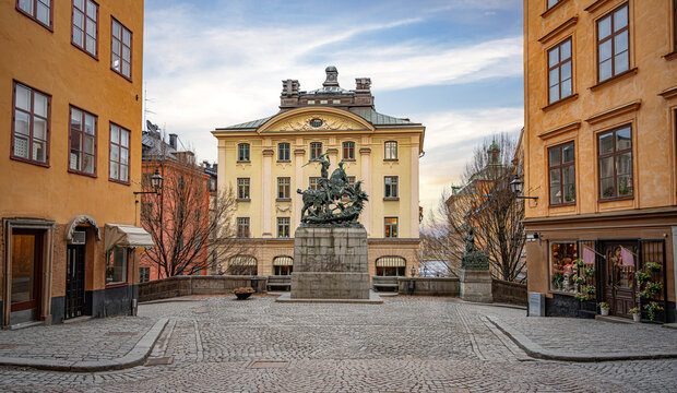 A bronze replica of the Saint George and the Dragon statue stands in the center of Kopmantorget square in the historic Gamla Stan district of Stockholm, Sweden.