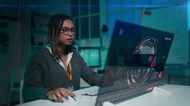 Female developer receives system error message on holographic computer screen