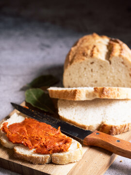 Mallorcan sobrasada spread on rustic bread with knife, traditional Spanish cured sausage concept