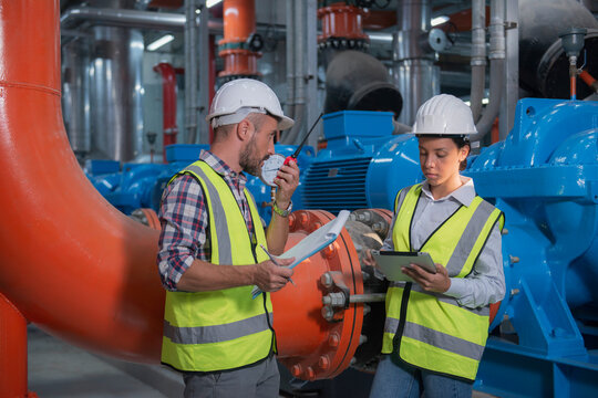 Mechanical engineer Checking of centrifugal pump in pump room. worker working in plant room.