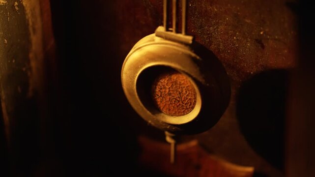 Pendulum swing motion of old vintage wall clock