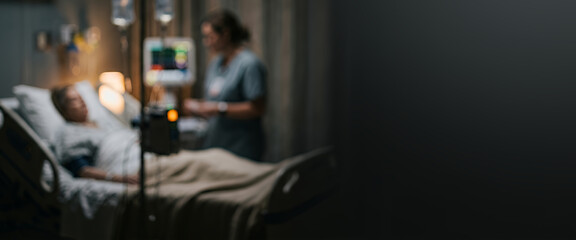 Obraz premium A nurse tending to a patient in a hospital room, showcasing a serene atmosphere with medical equipment in the background, focused on patient care.