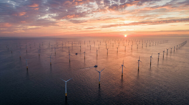 Sunset over offshore wind turbines