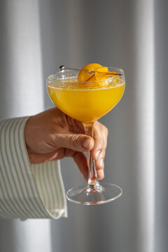 hand holding a glass