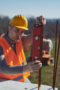 Construction worker working outdoors on a construction site.