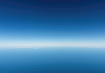Fototapeta premium A stunning, seamless, clear horizon line dividing the deep blue sky and the empty, flat earth below, suggesting unlimited potential and space ,backdrop ,potential ,background