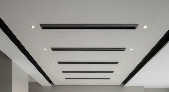 Modern architectural ceiling with multiple linear ventilation slots and integrated recessed lighting