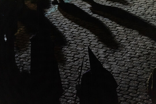 A large crowd gathers at dawn in Avila for the Penitential Via Crucis. The ancient Christ of the Executed statue is paraded along the city walls in a deeply traditional Good 