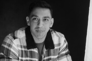 Obraz premium Black and white male portrait series – young man with various emotional expressions in studio setting