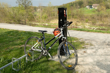 Fototapeta premium Public bicycle repair station on a scenic bike path.