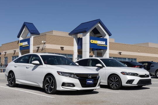 Used Honda Civic and Accord display at a CarMax dealership. With cost concerns, CarMax offers used cars with upfront prices.