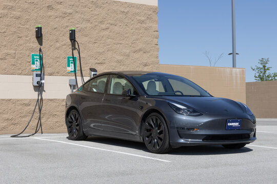Used Tesla Model 3 display at a CarMax dealership. With price concerns, CarMax offers used cars with upfront prices. MY:2023