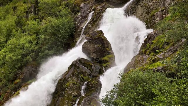 Kleivafossen waterfall on the way to Brikdalsbreen Glacier in Norway.