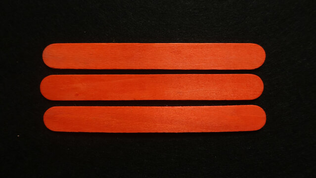 Three orange lines on a black background